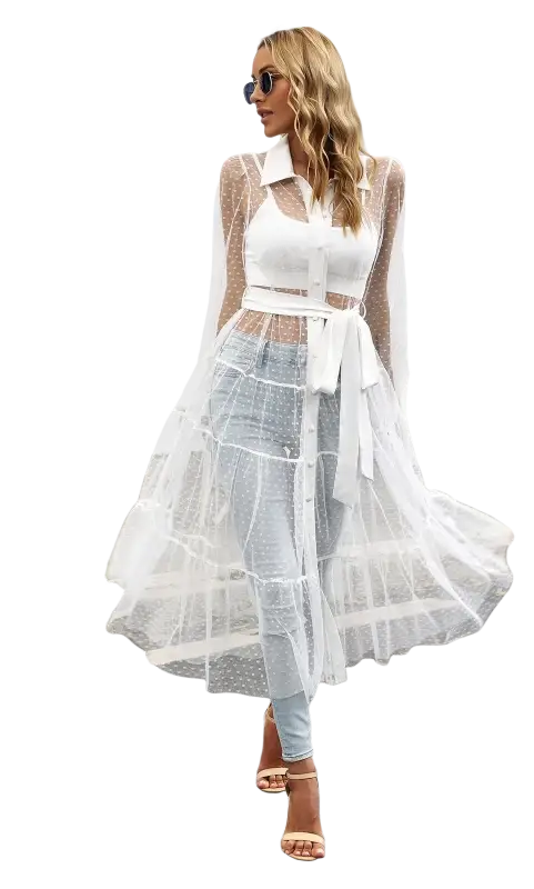 Elegant woman in sheer white polka dot summer mesh long sleeve waist dress