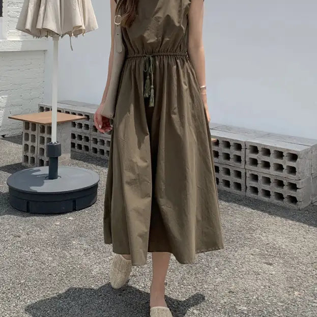 Olive green midi dress with a cinched waist and cap sleeves.