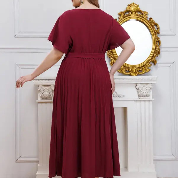 Elegant loose pleated maxi dress for women with V-neck, flutter sleeves, and belted waist