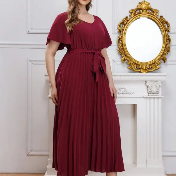 Plus-size maroon elegant loose pleated maxi dress with V-neck, flutter sleeves, and self-tie belt