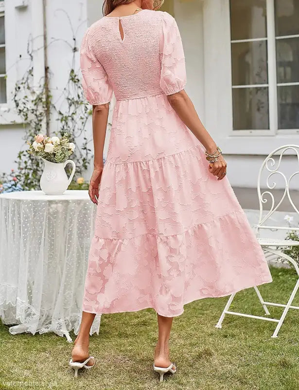 Pink textured midi dress featuring elegant pleated puff sleeve and cutout detail