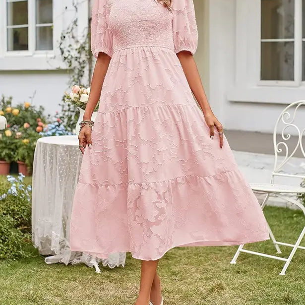 Pink tiered midi dress with pleated puff sleeve and stylish cutout details