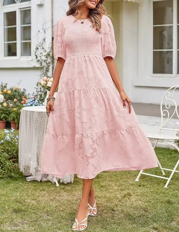Pink tiered midi dress with pleated puff sleeve and stylish cutout details