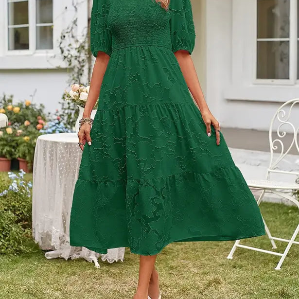 Emerald green midi dress featuring elegant pleated puff sleeve and stylish cutout detail