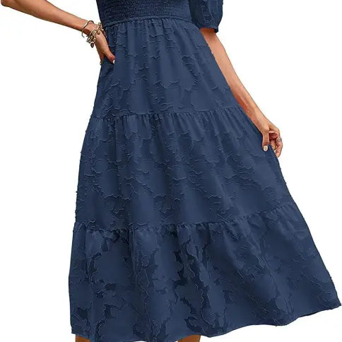 Navy blue tiered midi dress featuring pleated puff sleeve and cutout detail