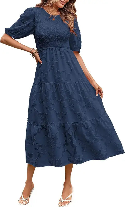 Navy blue tiered midi dress featuring pleated puff sleeve and cutout detail