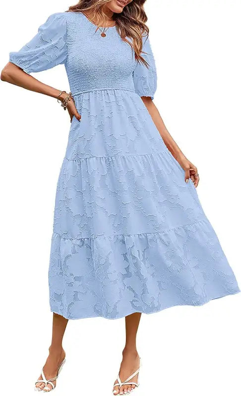 Light blue midi dress featuring pleated puff sleeve and elegant cutout detail