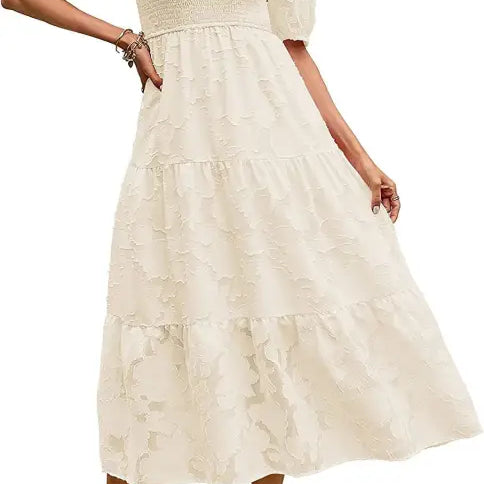Cream-colored tiered midi dress featuring elegant pleated puff sleeve and cutout detail