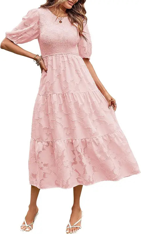 Pink tiered midi dress featuring pleated puff sleeve and stylish cutout detail