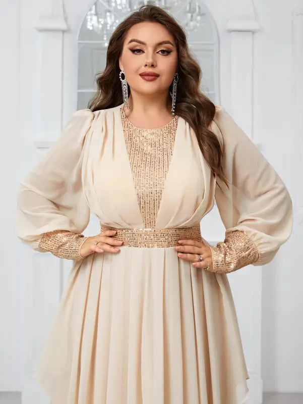 Elegant cream evening gown with sequined details and flowing sleeves for elegant party dress
