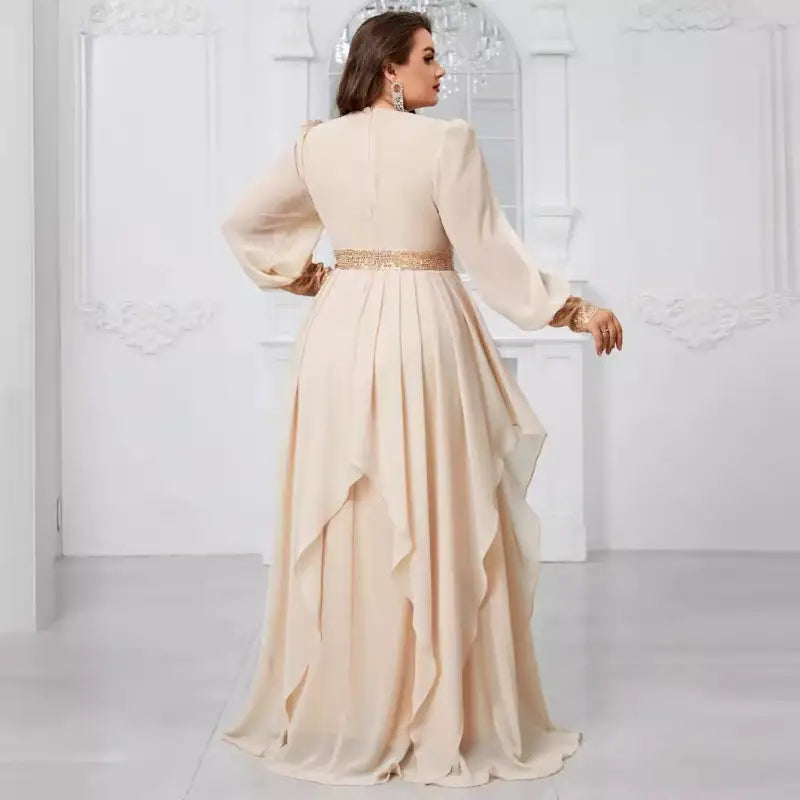 Cream-colored Elegant Maxi Dress with Ruffles, long balloon sleeves, and a gold belt