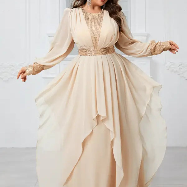 Flowing cream-colored evening gown featuring ruffles and elegant beaded detailing