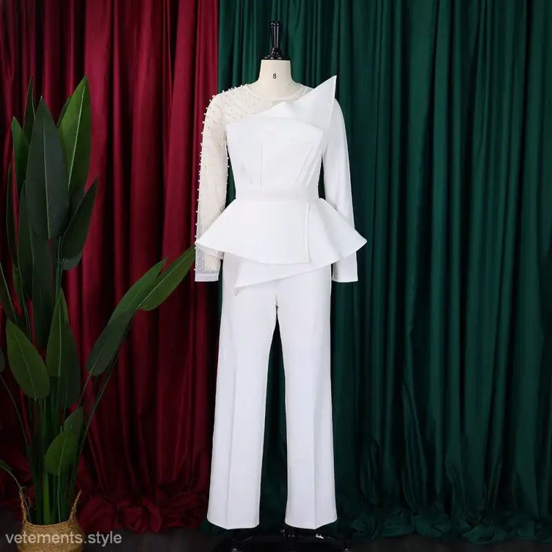 Elegant mesh beaded jumpsuit featuring a white peplum design for sophisticated fashion