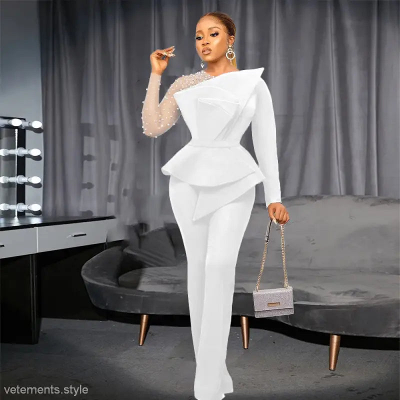 Elegant white mesh beaded jumpsuit featuring asymmetrical peplum for formal occasions