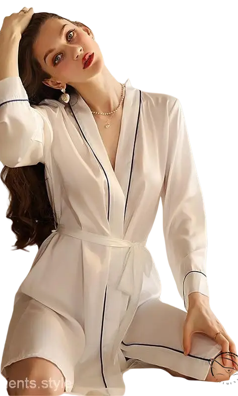 Woman in white bathrobe with navy piping over sexy midi silk pajamas