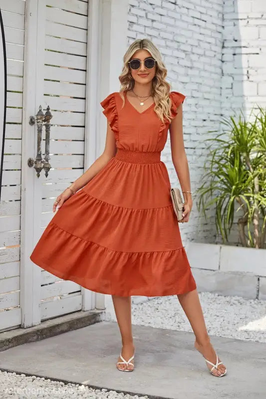 Rust-colored tiered midi dress with ruffled cap sleeves and V-neckline in Elegant Navy Blue Waist Pleated Dress