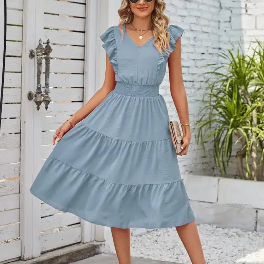 Light blue tiered midi dress with ruffled cap sleeves and elegant waist pleated design