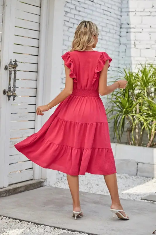 Vibrant red tiered midi dress with ruffled cap sleeves and fitted waist for elegant styling