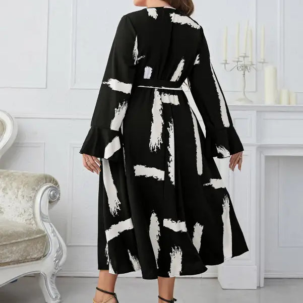 Elegant Neckline Flared Dress with Graffiti Cutout and Belted V-neck