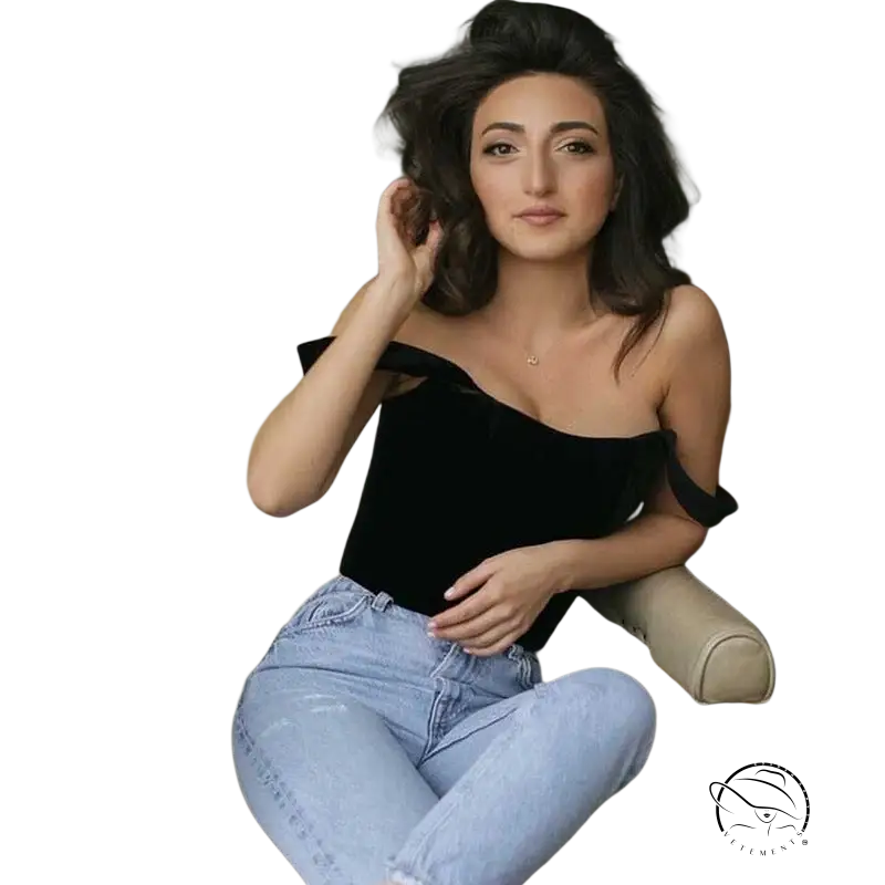 Woman in elegant off-shoulder satin crop top with soft outdoor boning corset and light-wash jeans