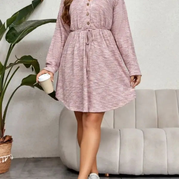 Elegant pink sweater dress with V-neck, long sleeves, drawstring waist, and button front
