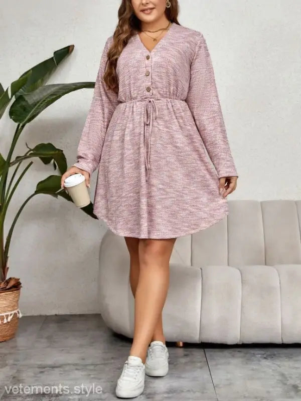 Elegant pink sweater dress with V-neck, long sleeves, drawstring waist, and button front