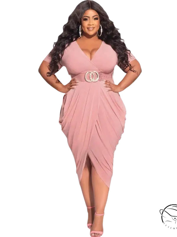 Woman in plunge sexy dress with belted waist and draped asymmetrical skirt