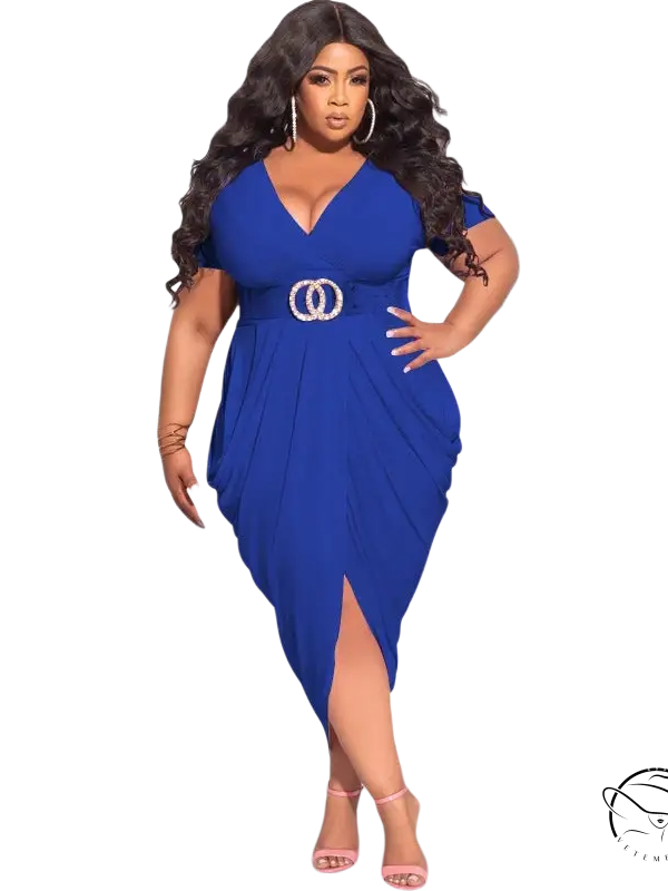 Woman in plunge sexy dress with cinched waist, asymmetrical design, and front slit