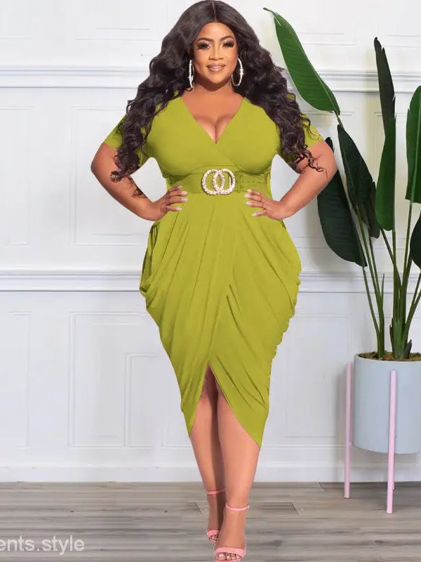 Woman wearing a lime green sexy tight split plunge dress with belted waist