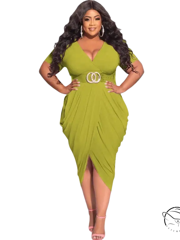 Woman in sexy plunge dress with belted waist and asymmetrical tight split