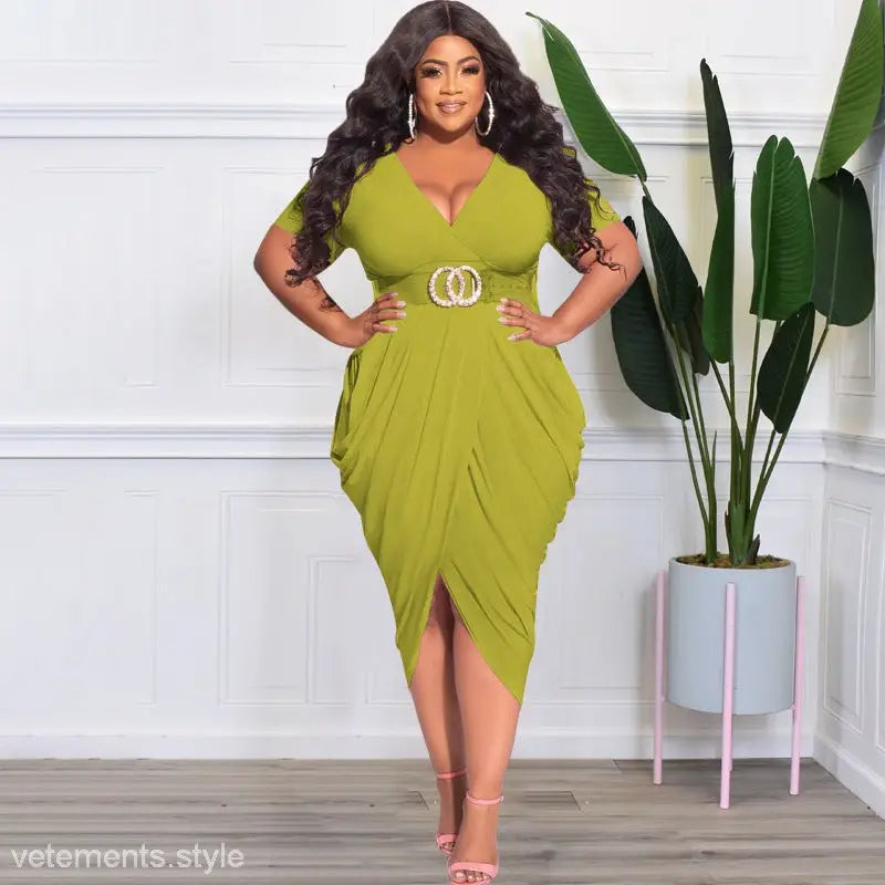 Woman wearing a lime green sexy tight split plunge dress with belted waist