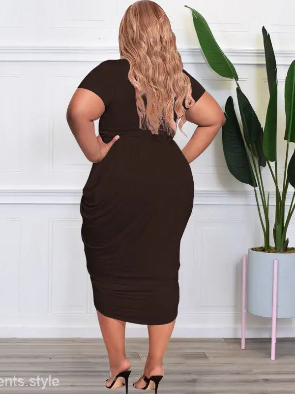 Elegant plunge sexy dress with tight split design, worn by a woman with long blonde hair
