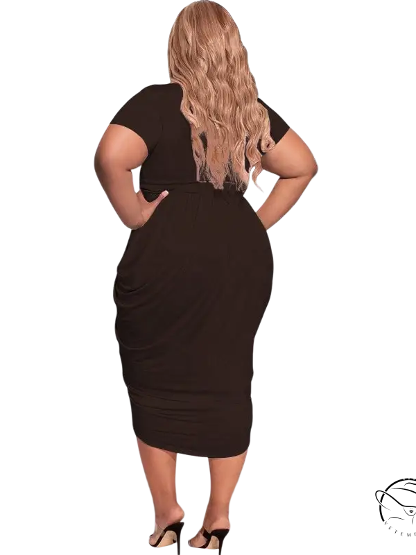 Woman in sexy tight split plunge dress with asymmetrical belted design