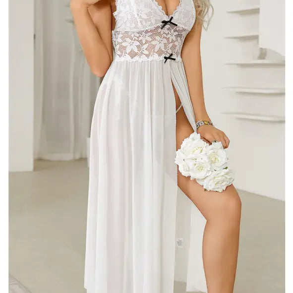 White lace-trimmed nightgown with a high slit and flowing skirt.