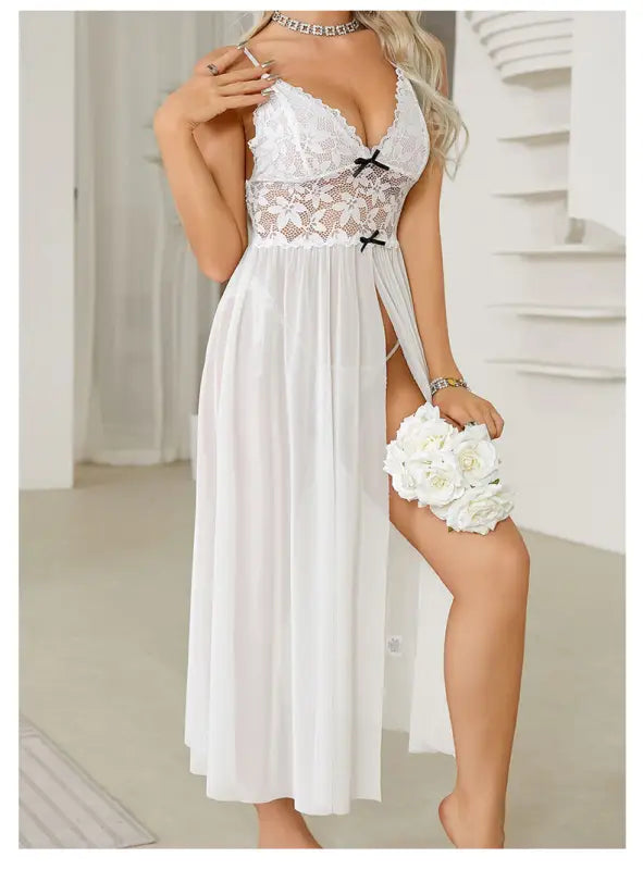 White lace-trimmed nightgown with a high slit and flowing skirt.