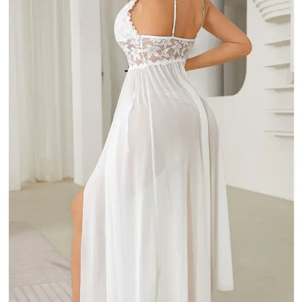 White lace-trimmed nightgown with spaghetti straps and a flowing skirt.