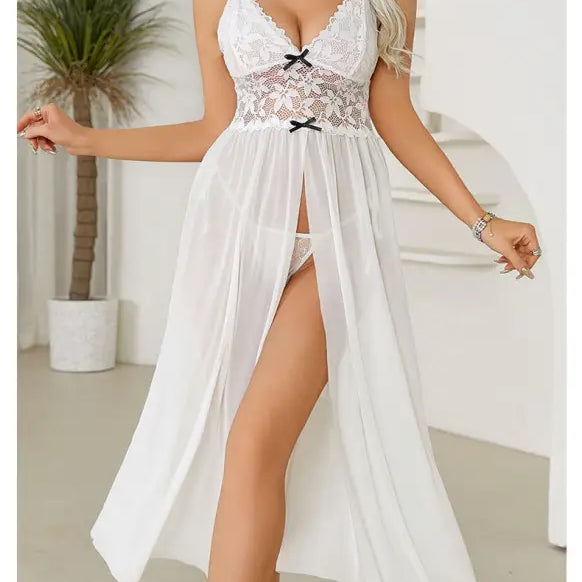 White lace-trimmed lingerie nightgown with a flowing skirt and high slit.