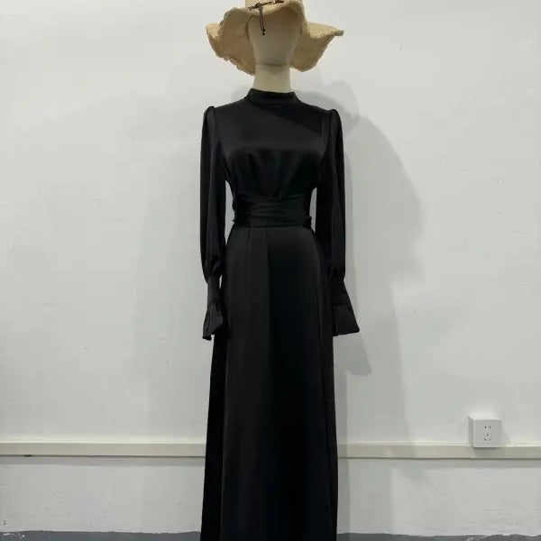 Elegant puff sleeve dress with a high neck, long sleeves, and beige wide-brimmed hat