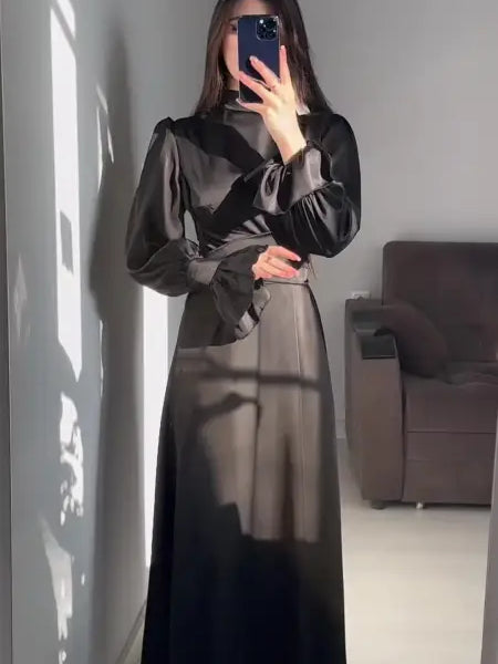 Elegant puff sleeve dress with billowy sleeves and cinched waist in a mirror selfie