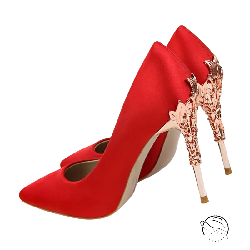 Elegant red wedding heels with ornate rose gold metallic heels for brides