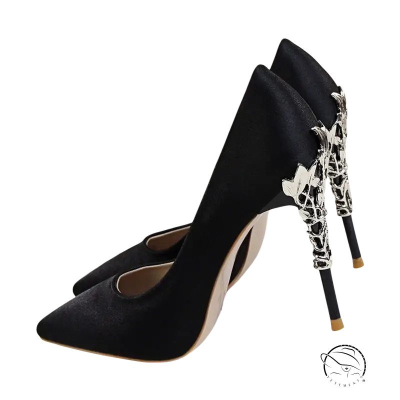 Pair of elegant red wedding heels with ornate silver metal heels for brides