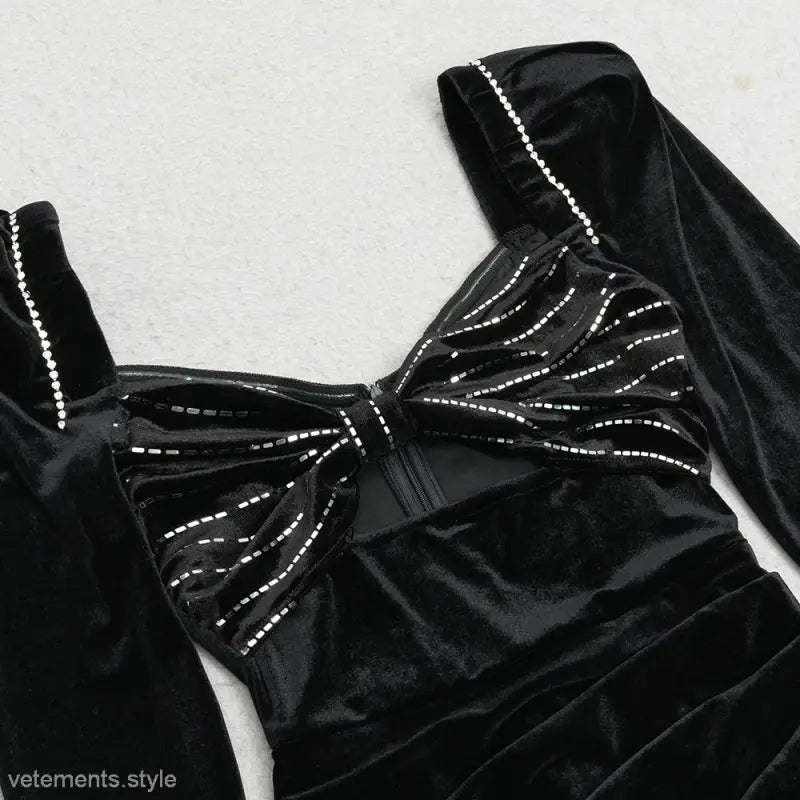 Black velvet bow tie with silver sequins on sexy evening party dress