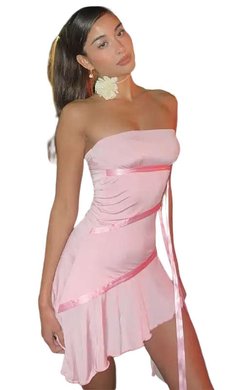 Woman in ruffled sexy strapless pink mini dress with white flower hair accessory