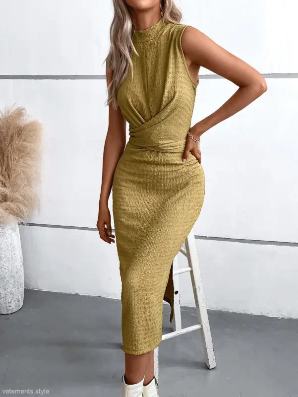 Elegant round neck slit dress featuring a sleeveless gold midi design for summer wear