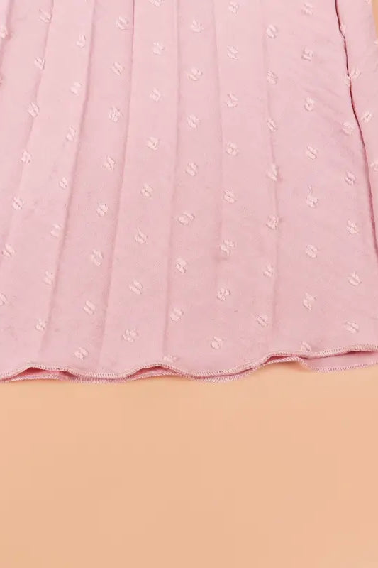 Pleated pink fabric with raised dots on elegant maxi dress, perfect vacation dress