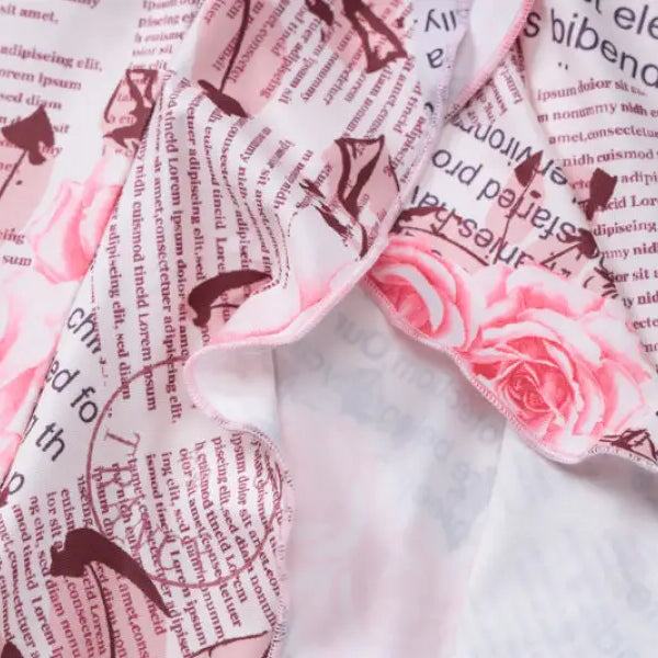 Floral and newspaper-print fabric on elegant ruffled high slit strap dress for summer parties