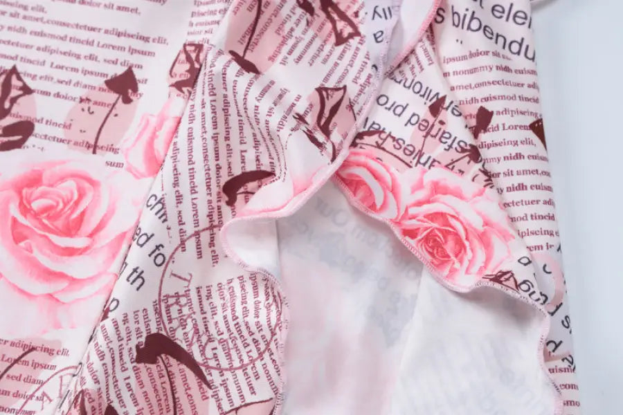 Floral and newspaper-print fabric on elegant ruffled high slit strap dress for summer parties