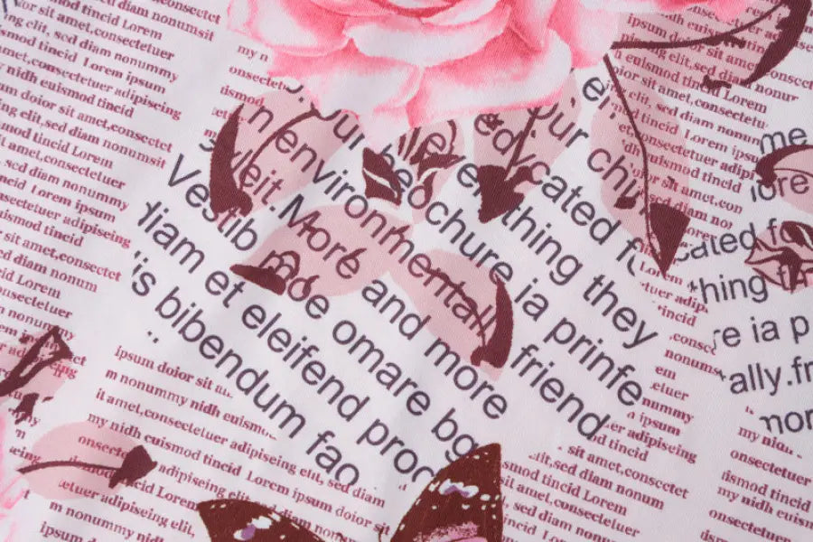 Floral fabric with newspaper print in an elegant ruffled high slit strap dress for summer parties