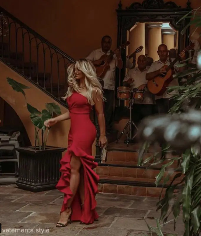 Elegant ruffled slit dress featuring a red one-shoulder design and asymmetrical ruffled details