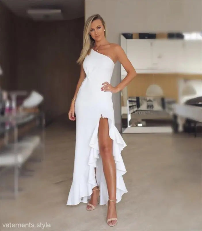 Elegant ruffled slit maxi dress with one-shoulder design and ruffled slit detail